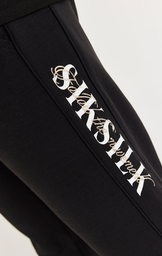 Pantalón panel SikSilk con logotipo y caligrafía doble - Negro