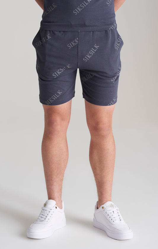 Pantalón corto SikSilk con estampado completo de monograma - Gris